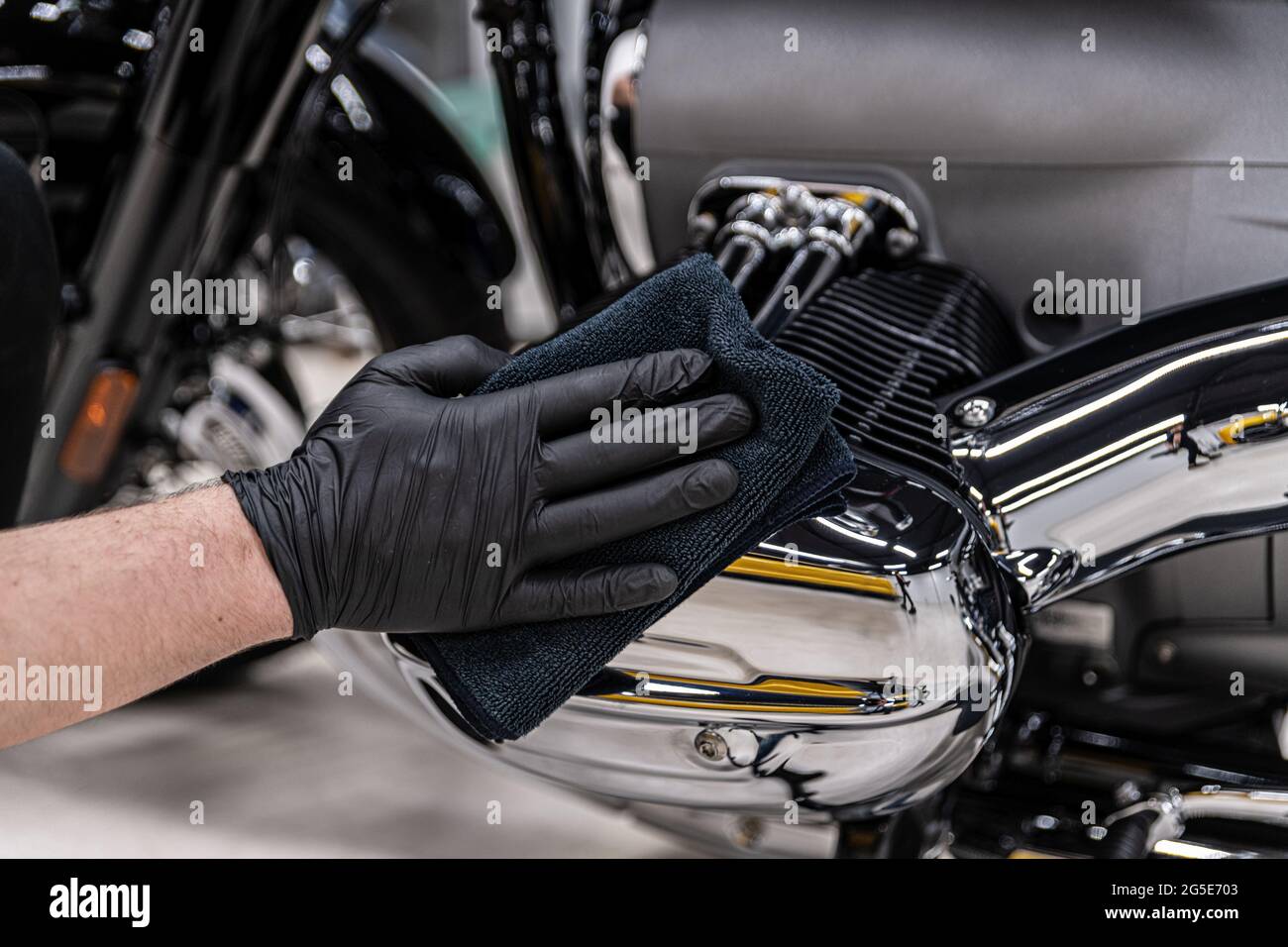 Polishing and cleaning chrome motorcycle part Stock Photo Alamy