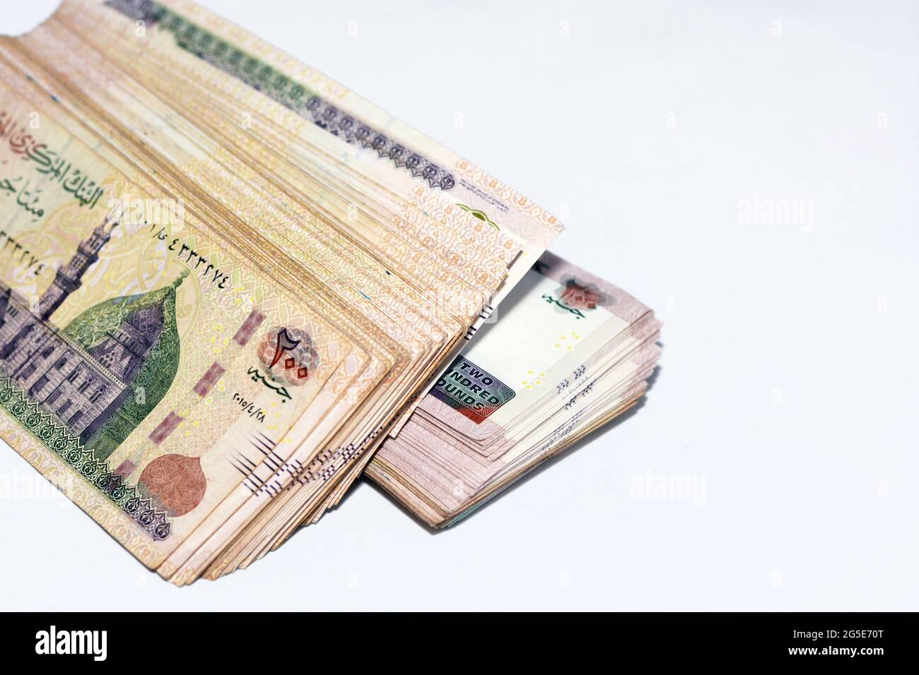 Stacks of 200 Egyptian pounds banknote, obverse side with image of Mosque of QaniBay Cairo Stacks of 200 Egyptian pounds banknote, obverse side with image of Mosque of QaniBay Cairo