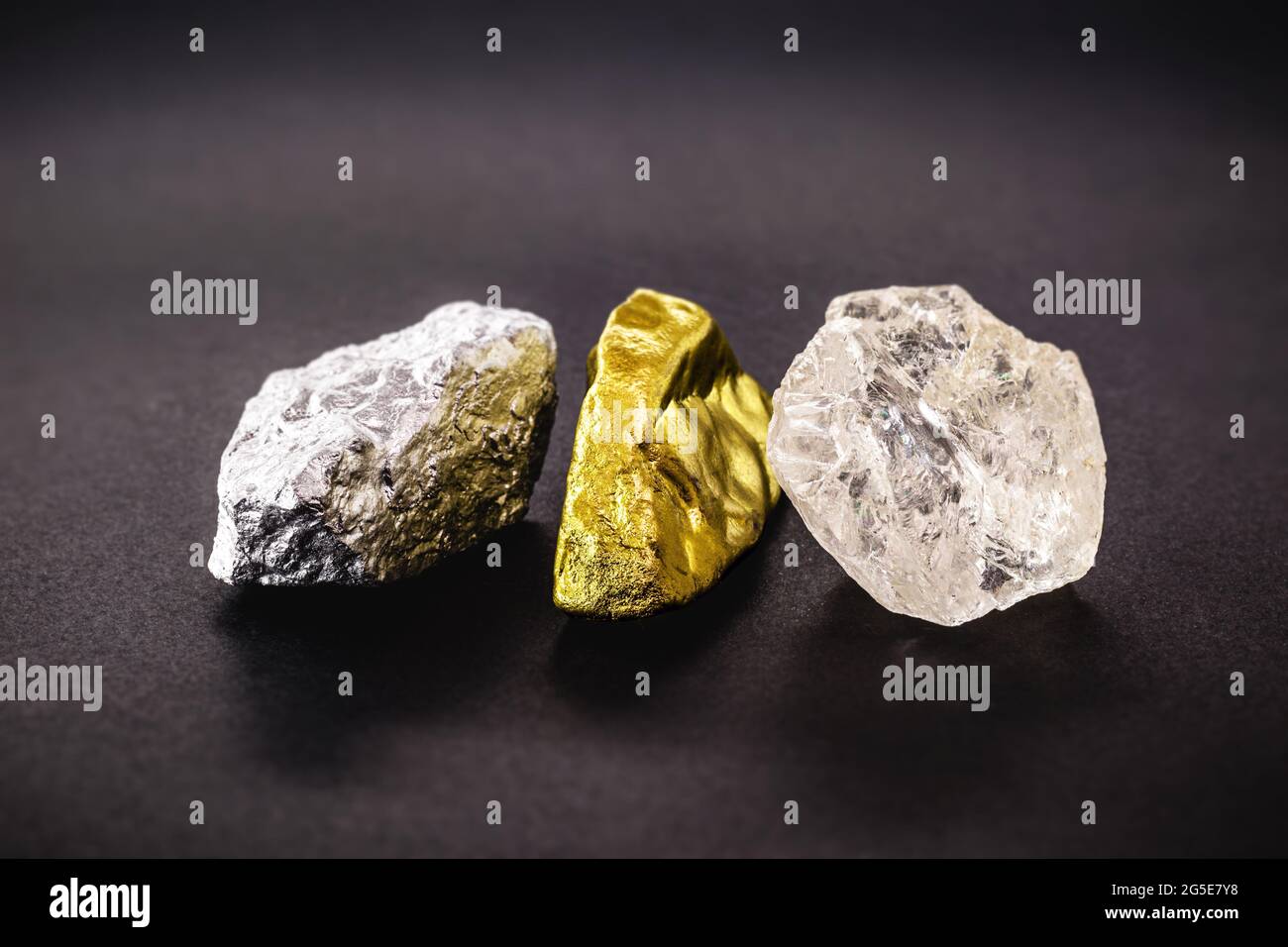 rough diamond stone with rough nuggets of gold and silver, concept of gemstones and minerology Stock Photo