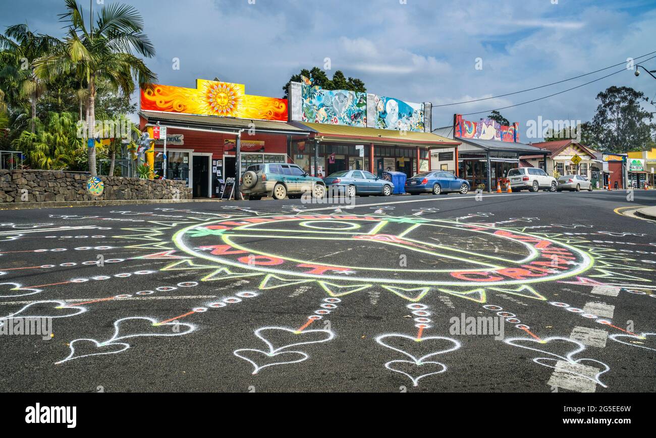 street art in the centre of Nimbin village against the backdrop of colourful painted shopfronts, Northern Rivers area of New South Wales, Australia Stock Photo