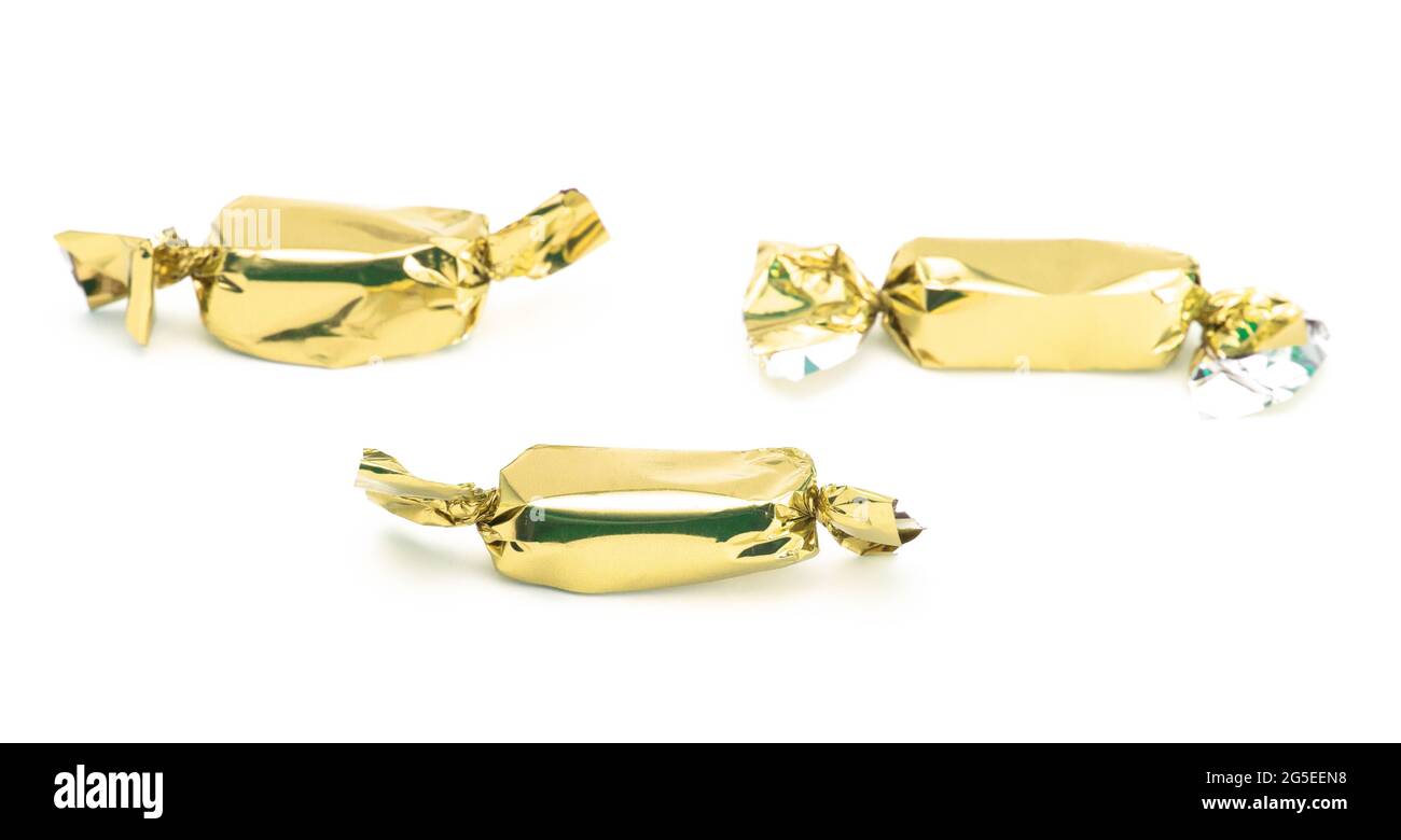 Gold Wrapped Candy on a White Background Stock Photo Alamy