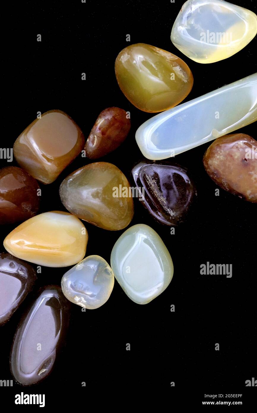 Yellow Agate jewel stones heap up texture on black background