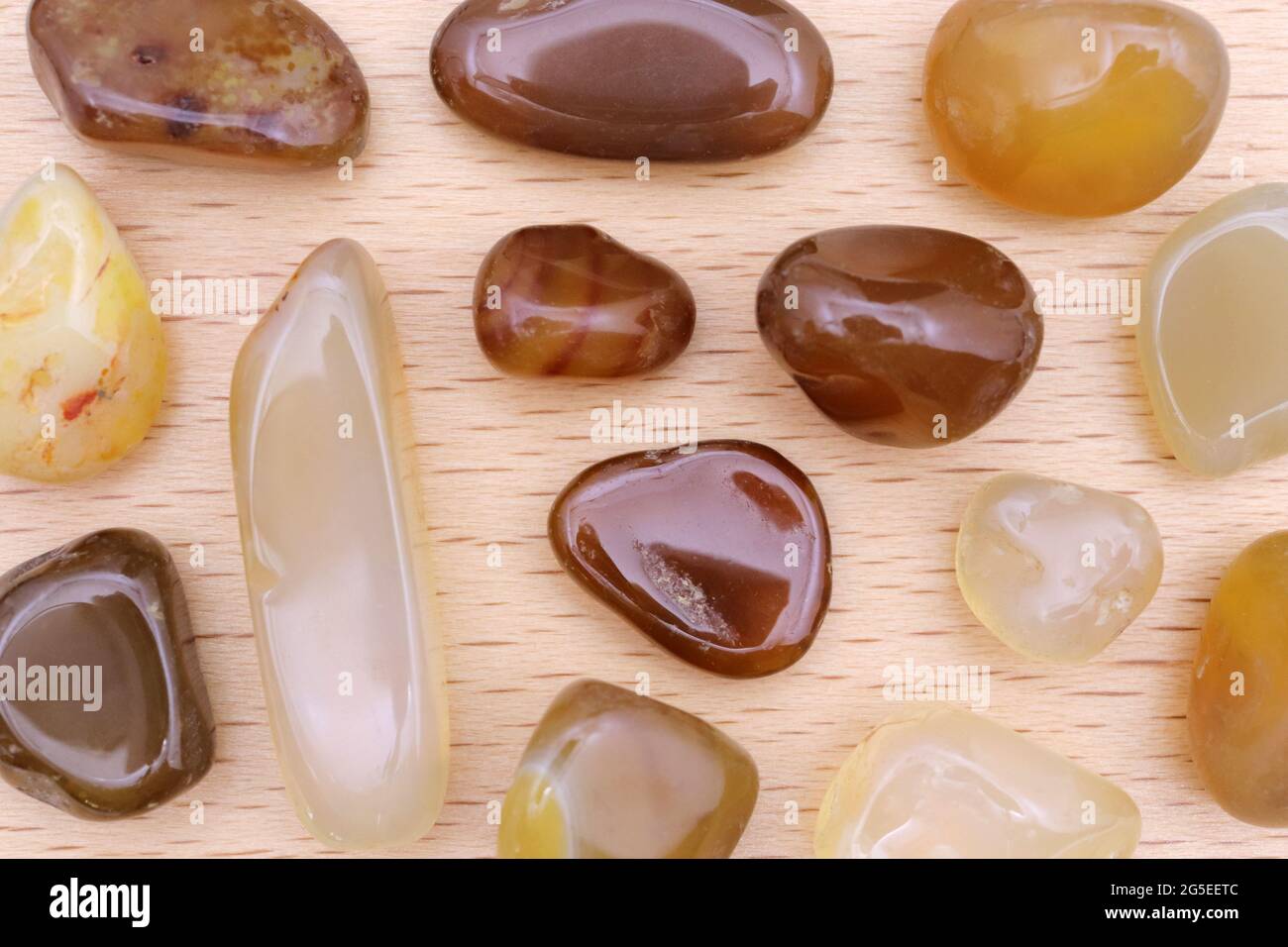 Yellow Agate jewel stones rare texture on light varnished wood