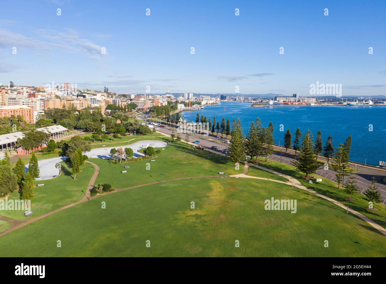 Aerial view of park and cityscape adjacent to Newcastle Harbour and the