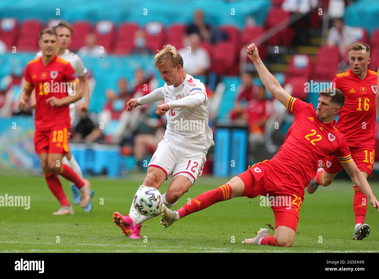 Amsterdam, Netherlands. 26th June, 2021. Kasper Dolberg (L, Front) of Denmark scores the UEFA Euro 2020 Championship Round of 16 match between Wales and Denmark at Johan Cruijff ArenA in Amsterdam, the Netherlands, June 26, 2021. Credit: Zheng Huansong/Xinhua/Alamy Live News Stock Photo