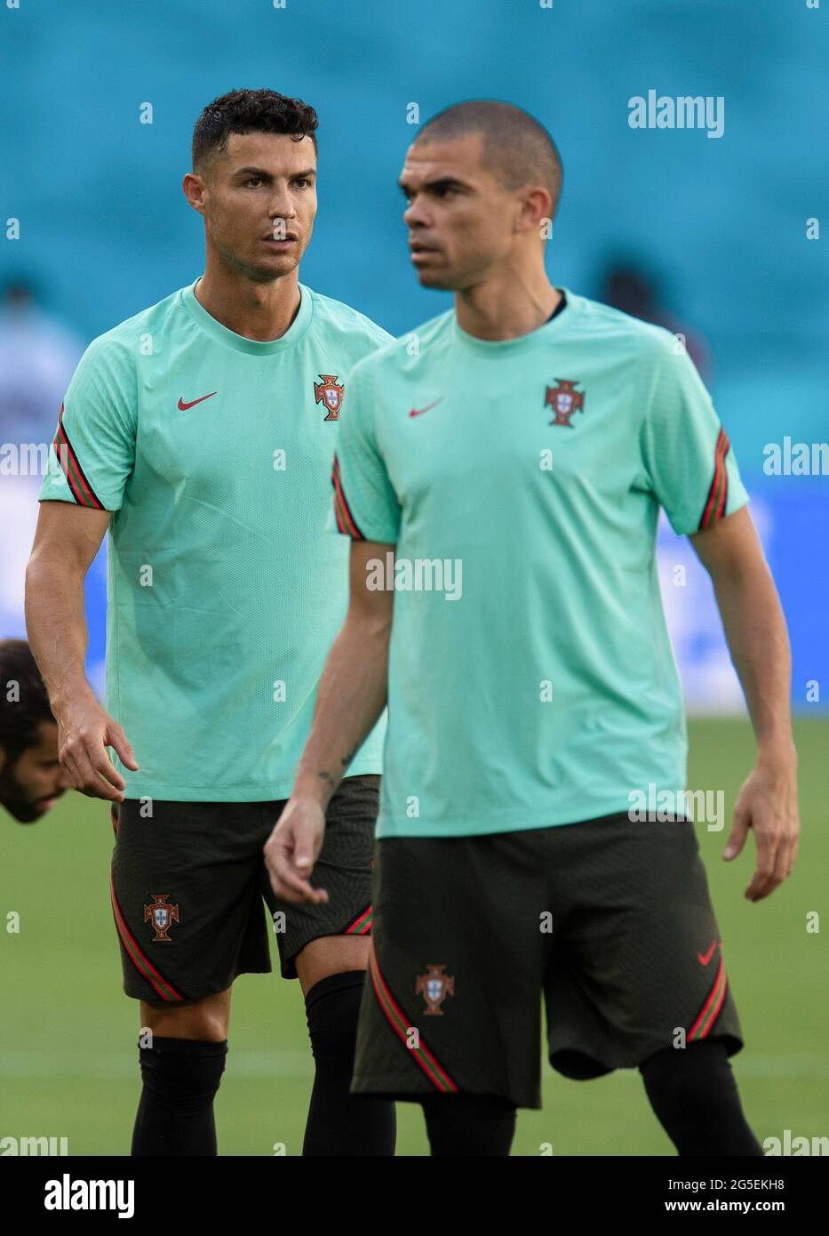 Seville. 26th June, 2021. Cristiano Ronaldo (L) and Pepe of Portugal attend a training session in Seville, Spain, June 26, 2021, on the eve of the UEFA Euro 2020 Championship Round of 16 match against Belgium. Credit: Meng Dingbo/Xinhua/Alamy Live News Stock Photo