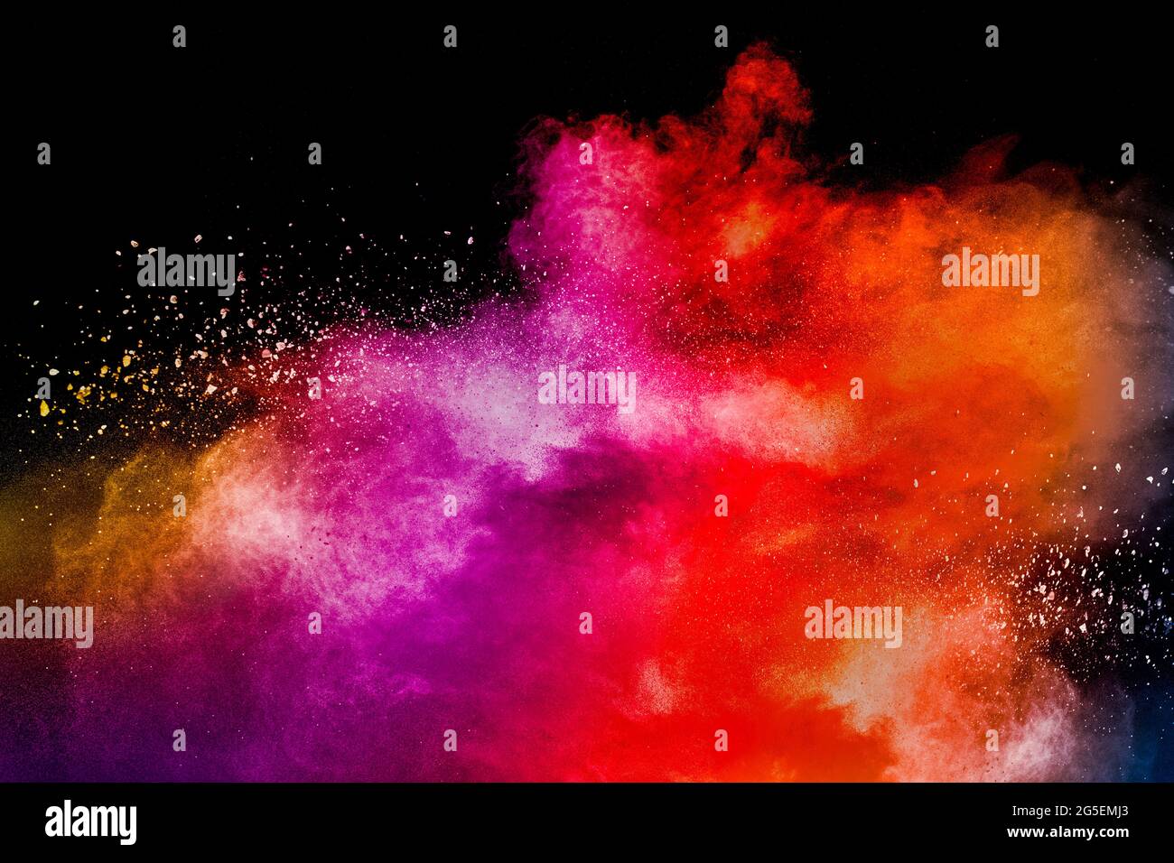 Colored powder explosion. Abstract closeup dust on backdrop. Colorful explode. Paint holi. Stock Photo