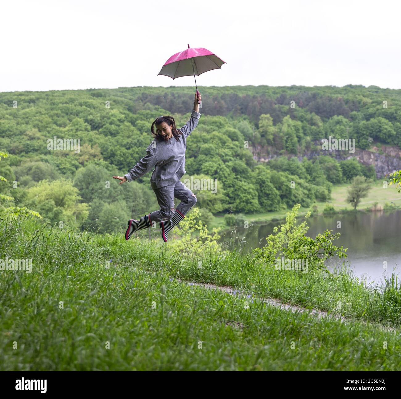 Girl jumping in river hi-res stock photography and images - Alamy