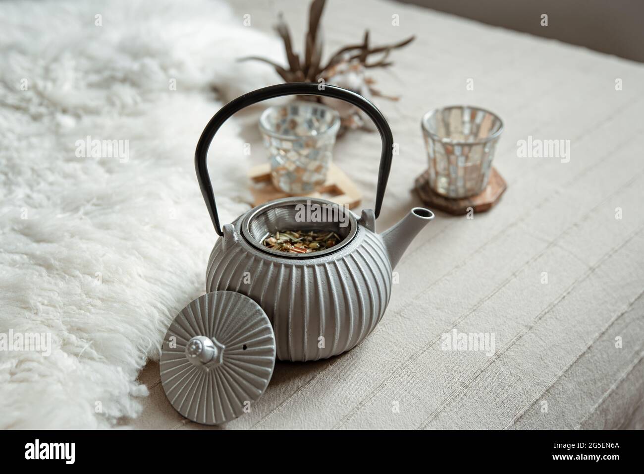Close-up of a teapot in a Scandinavian style with tea. Stock Photo