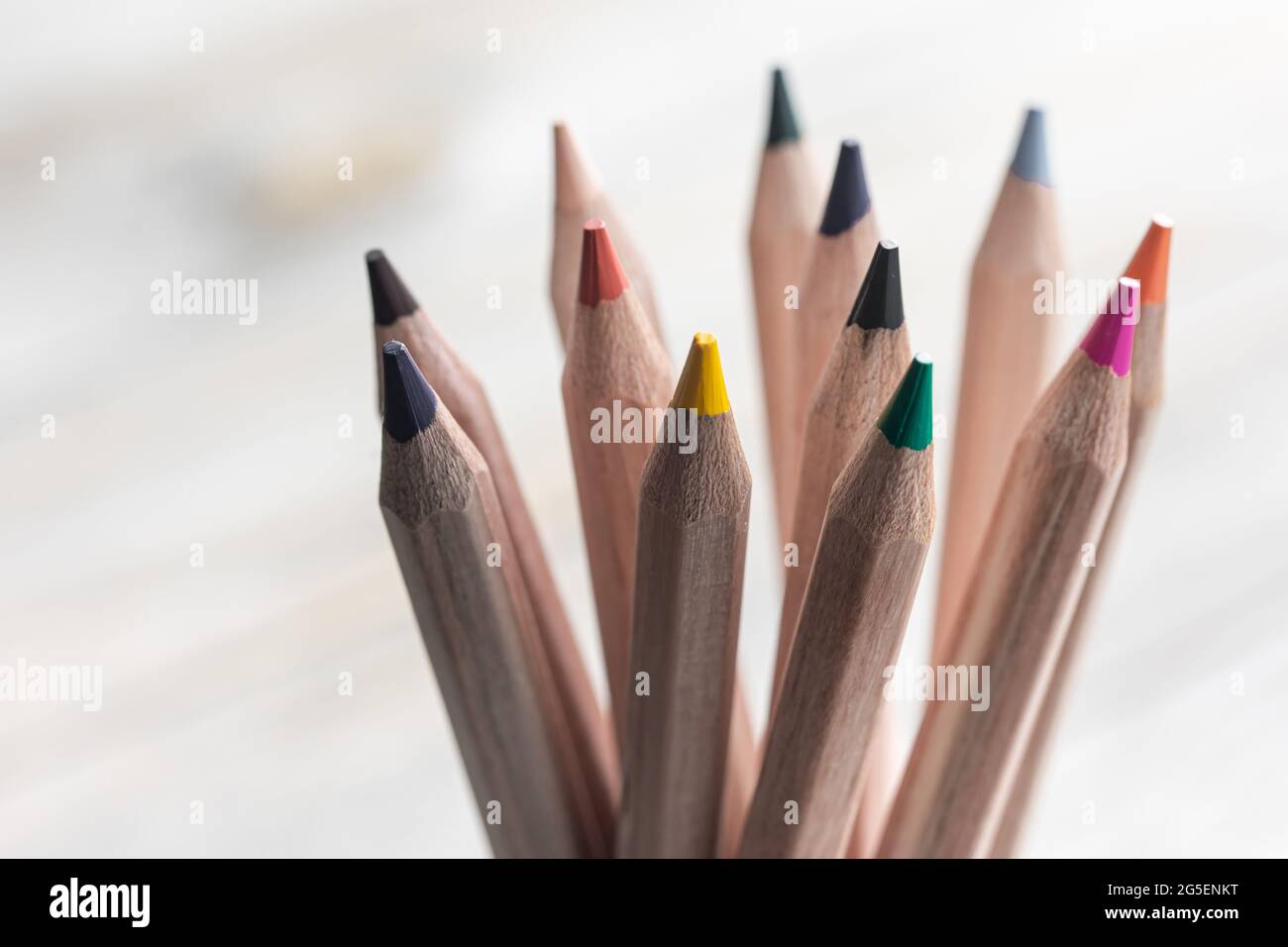 Close up of colored pencils for drawing on blurred background Stock Photo