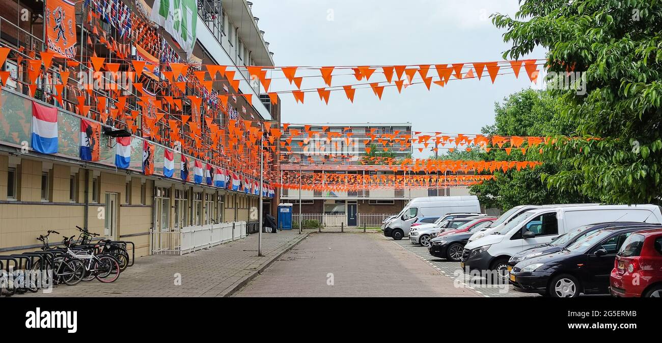 A Dutch street is decorated with flags to support the Dutch national soccer team. Stock Photo