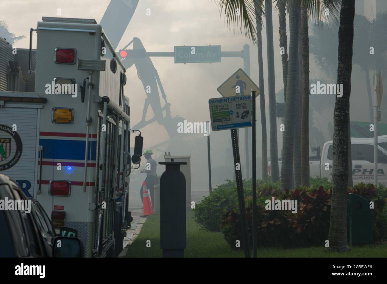 Washington, USA. 26th June, 2021. Rescuers work at the site of the residential building collapse in Miami-Dade County, Florida, the United States, on June 26, 2021. The death toll from the partial collapse of a 12-story residential building has risen to five while the number of missing people rose to at least 159, local media reported on Saturday. Credit: Monica McGivern/Xinhua/Alamy Live News Stock Photo