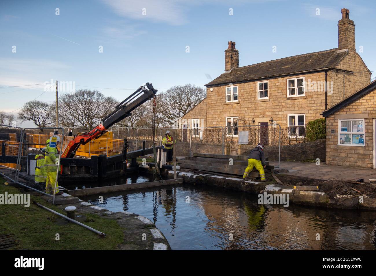 Workers from the Canal and River Trust replacing a pair of lock gates on the Leeds Liverpool canal Stock Photo