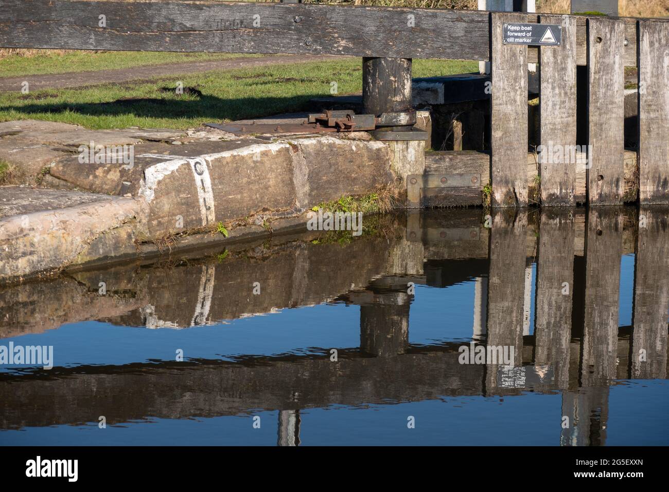 Lock gates reflected in the Leeds Liverpool canal Stock Photo