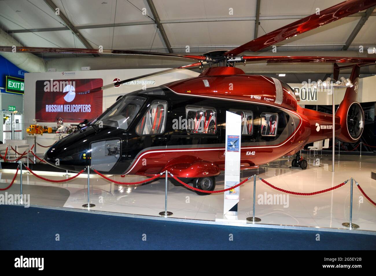 Russian Helicopters exhibition stand with a Kamov KA-62 helicopter at the Farnborough International Airshow trade show 2012, UK. Exhibition hall Stock Photo