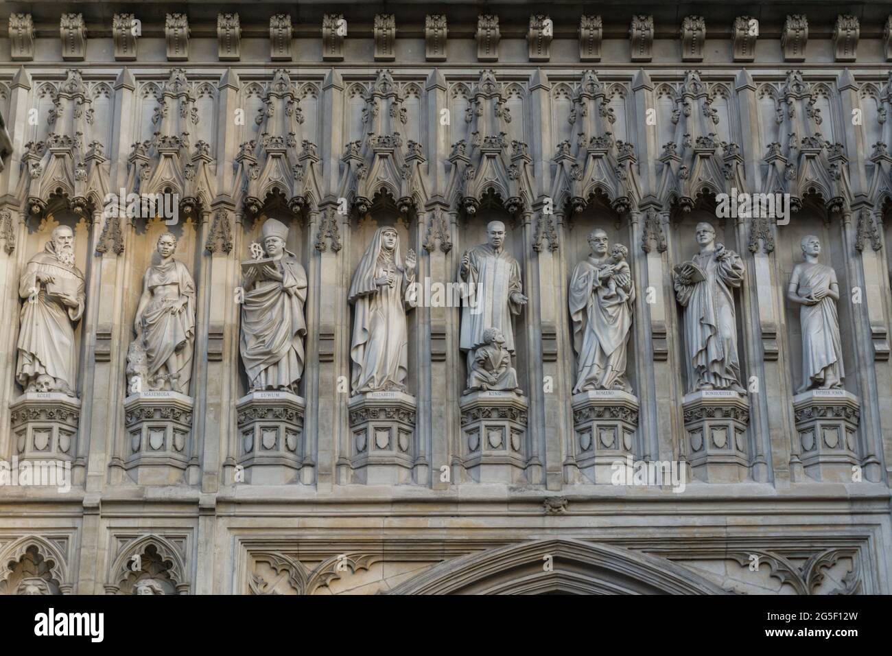Close up detail of religious figures on the outside wall of Westminster Abbey, cathedral London, England Stock Photo