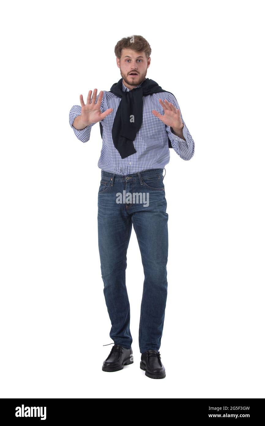 Reppeling Sign Young man with repelling gesture ni stop sign. Full length portrait ...