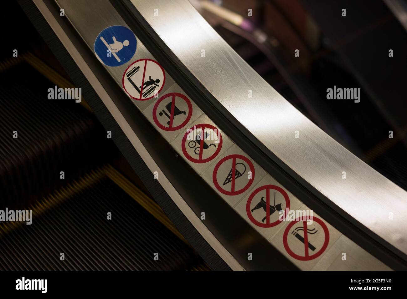 warning signs on escalator , close up Stock Photo