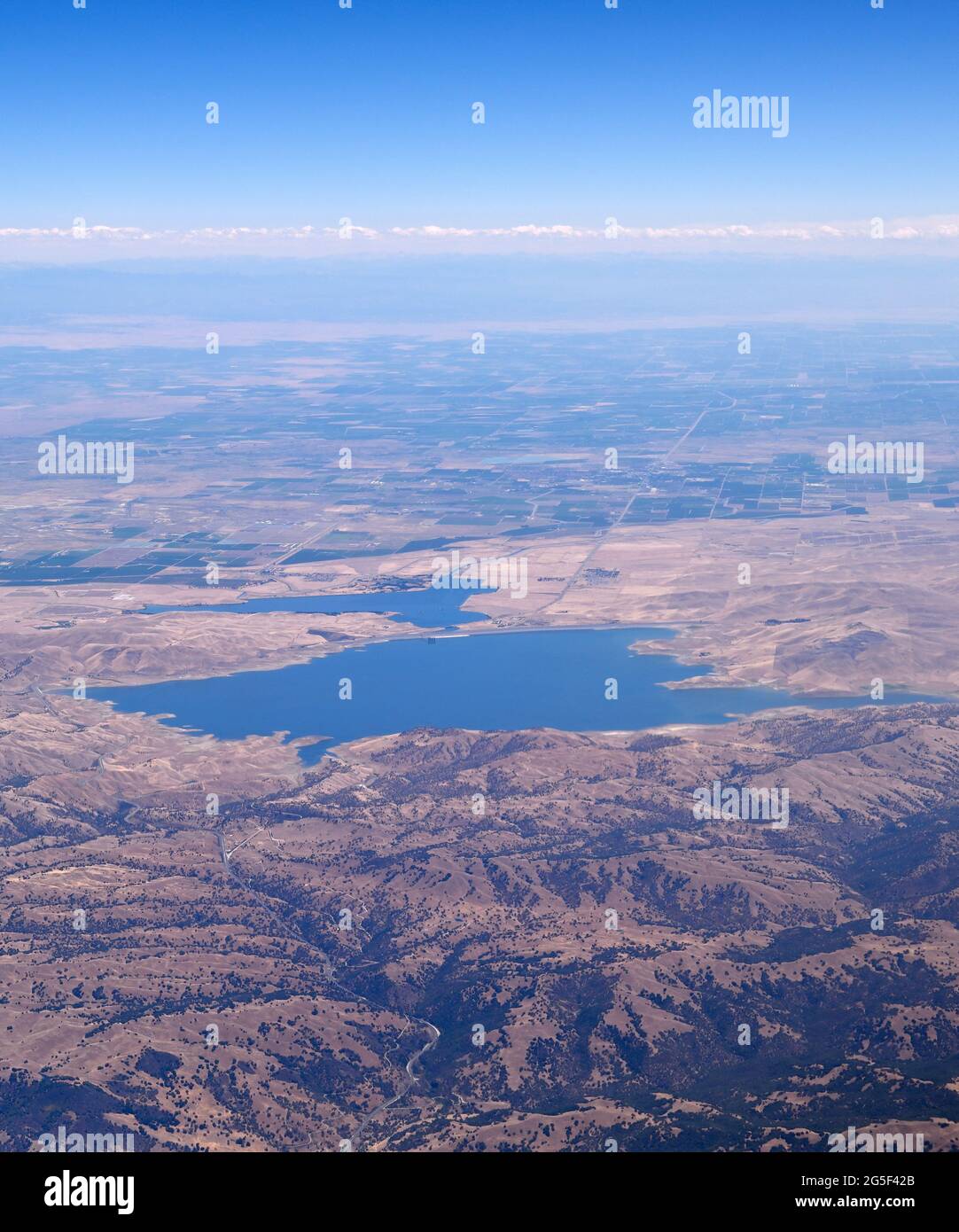 The shores of San Luis Reservoir with the Central Valley (aerial view