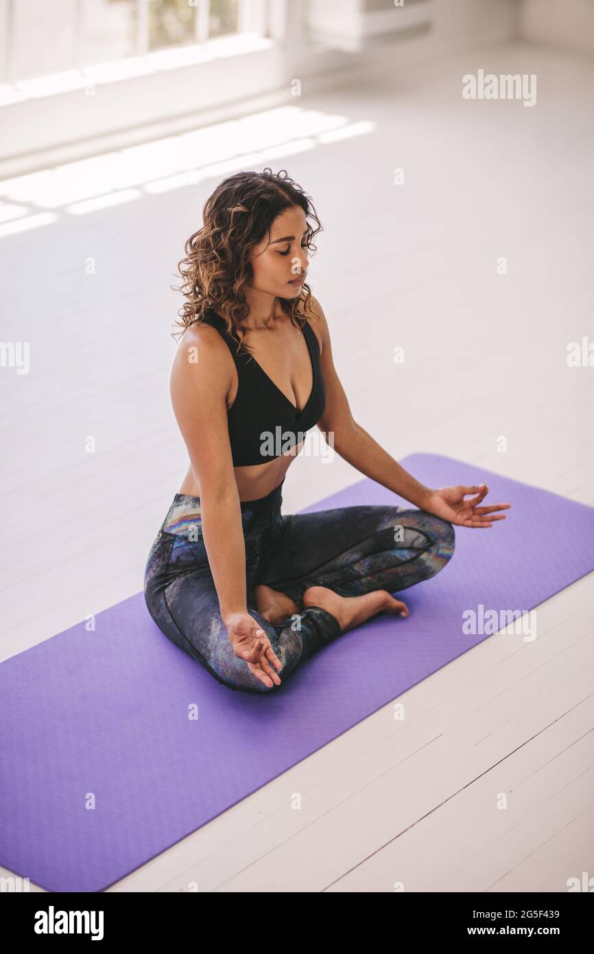 Beautiful Young Woman Doing Yoga or Pilates Exercise Arm Balance with Crossed  Legs, Scale Posture, Tolasana, Utpluthi on Stock Photo - Image of female,  practice: 141935064