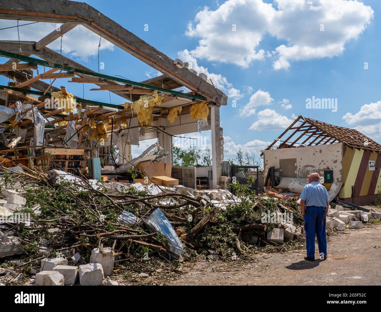 A man seen looking at the former school building, destroyed by a 