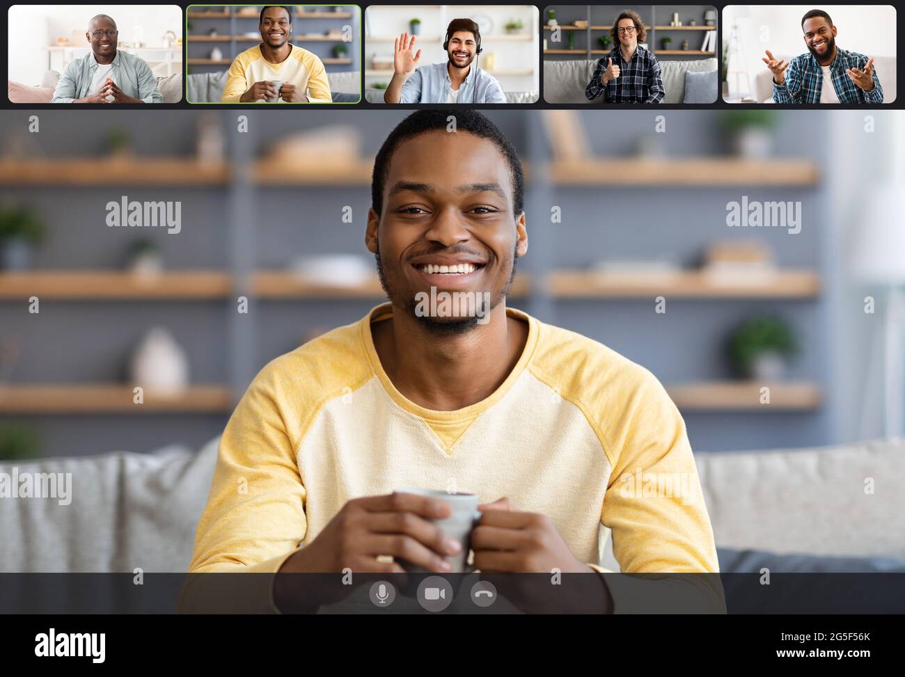 Laptop webcam screen view of multiethnic men contacting distantly by  videoconference. Smiling diverse friends making video call enjoying  communication Stock Photo - Alamy