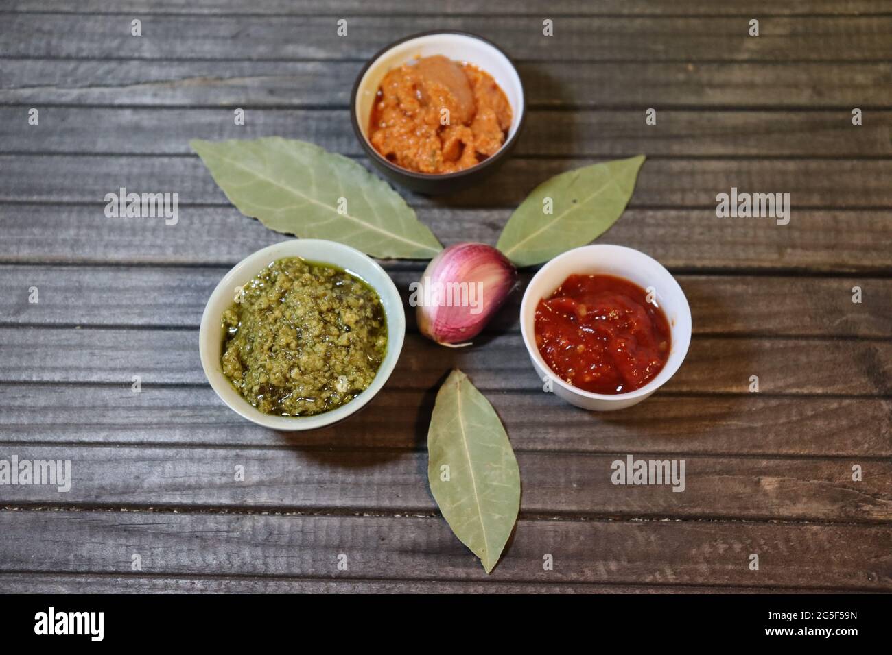 Ingredients, red and green pesto, adjika garlic and bay leaf Stock