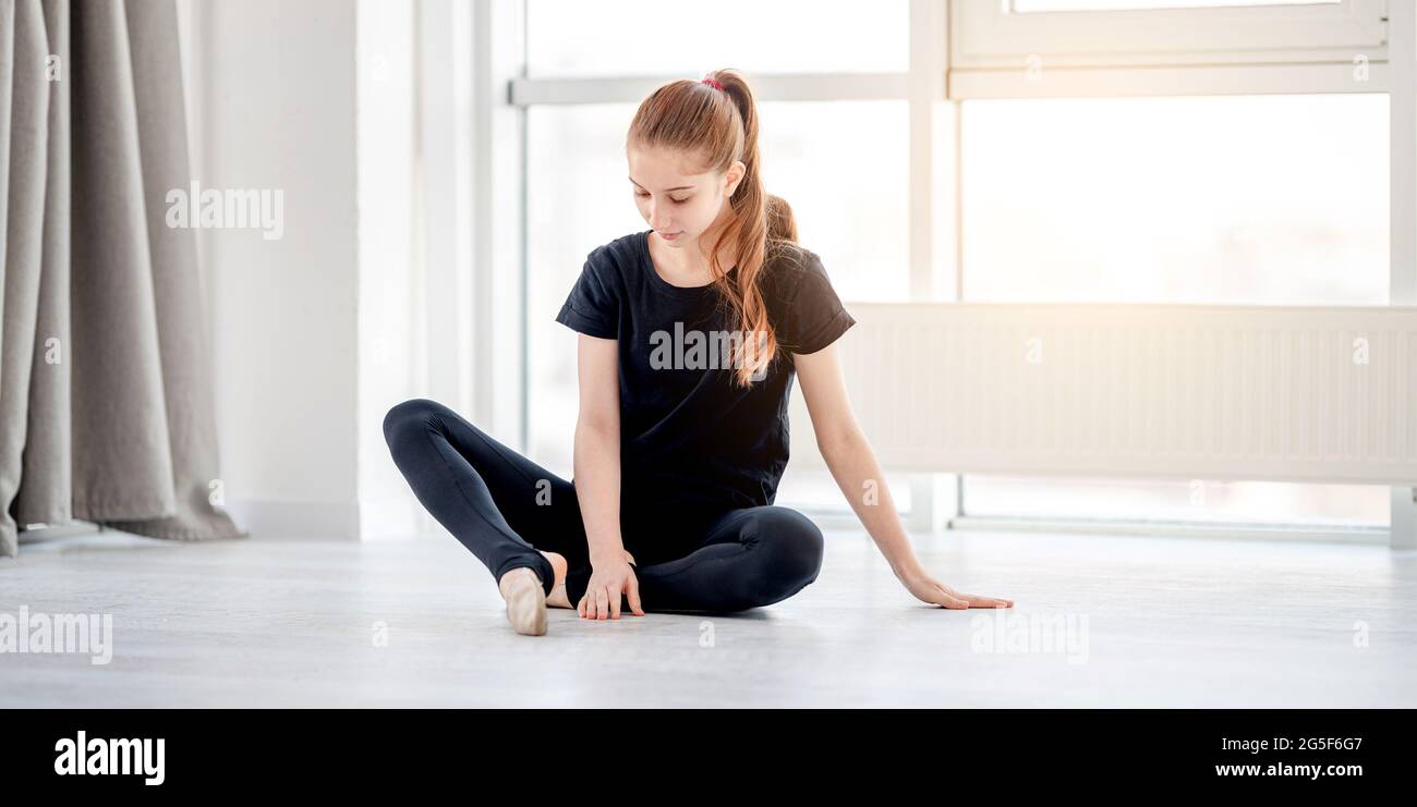 Girl in ballet training studio Stock Photo