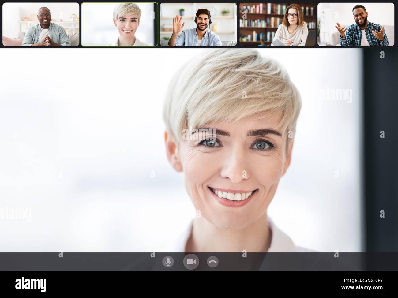 Telecommuting Concept. Smiling businesspeople using videoconference application, engaged in online meeting working distantly from home, computer webca Stock Photo