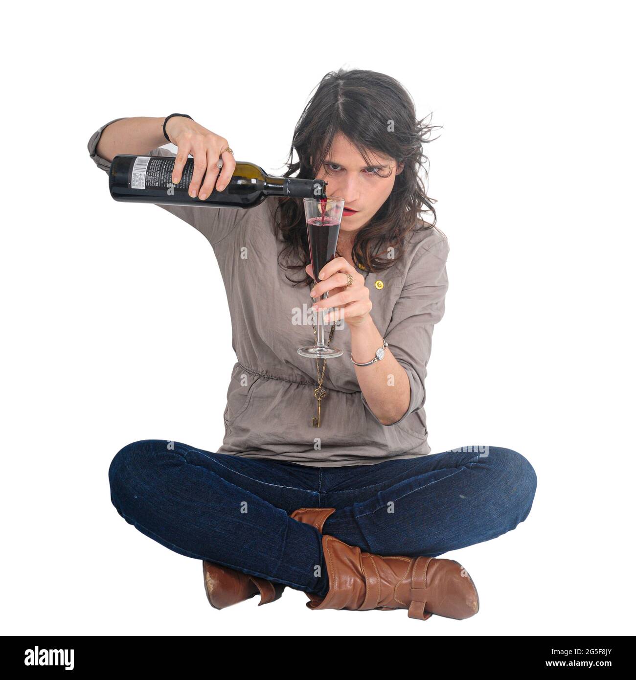 young woman drinks red wine studio shot on white background Stock Photo