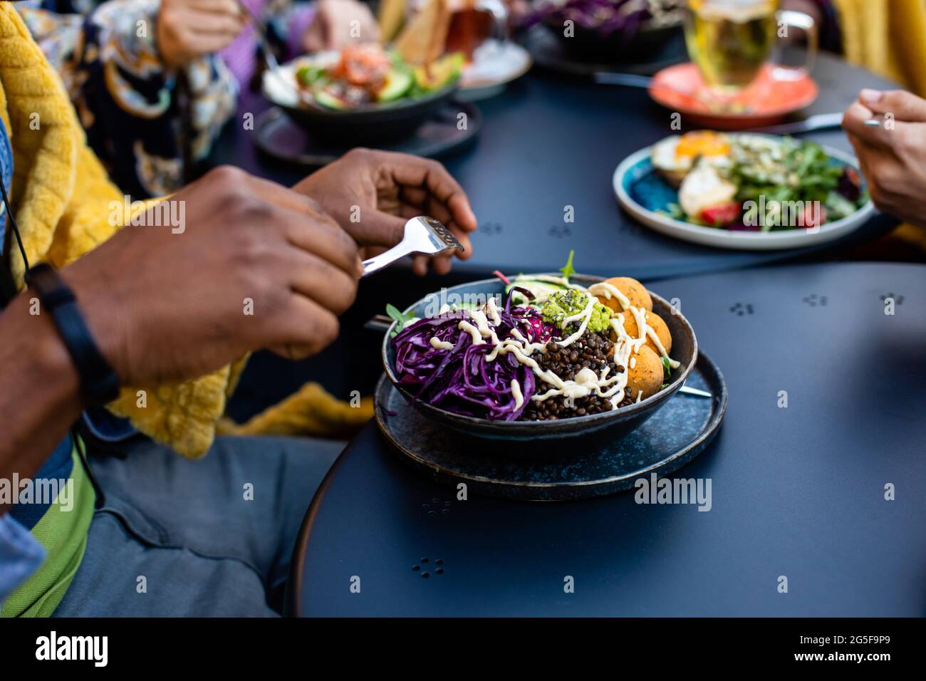 Top view cafe table with bowls of salad Stock Photo - Alamy