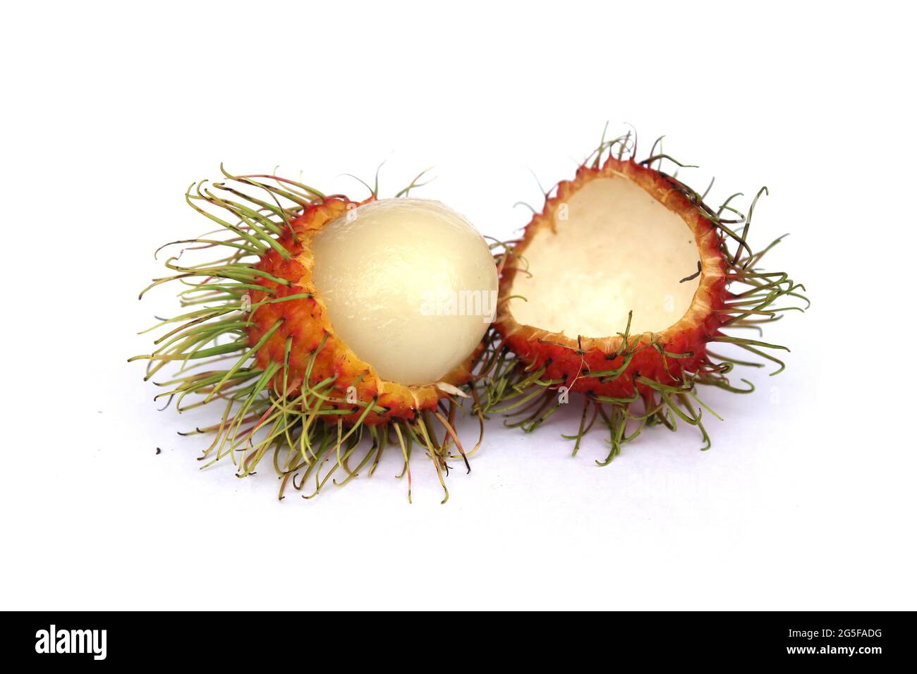 Sweet rambutan, a popular fruit of Thailand, is peeled off to reveal ...