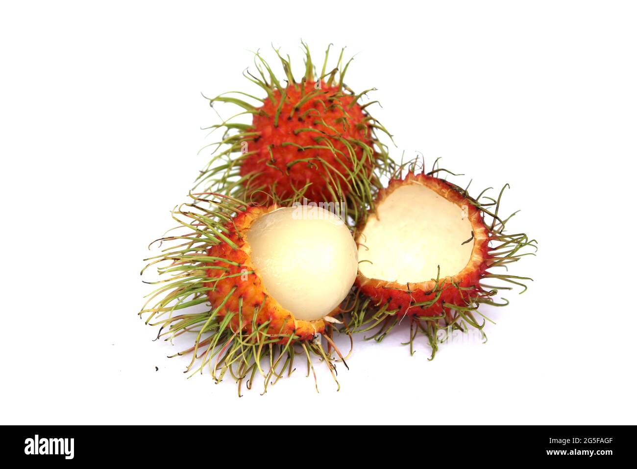 Sweet rambutan, the popular fruit of Thailand Peel off the bark to reveal the inside. isolated from a white background Stock Photo