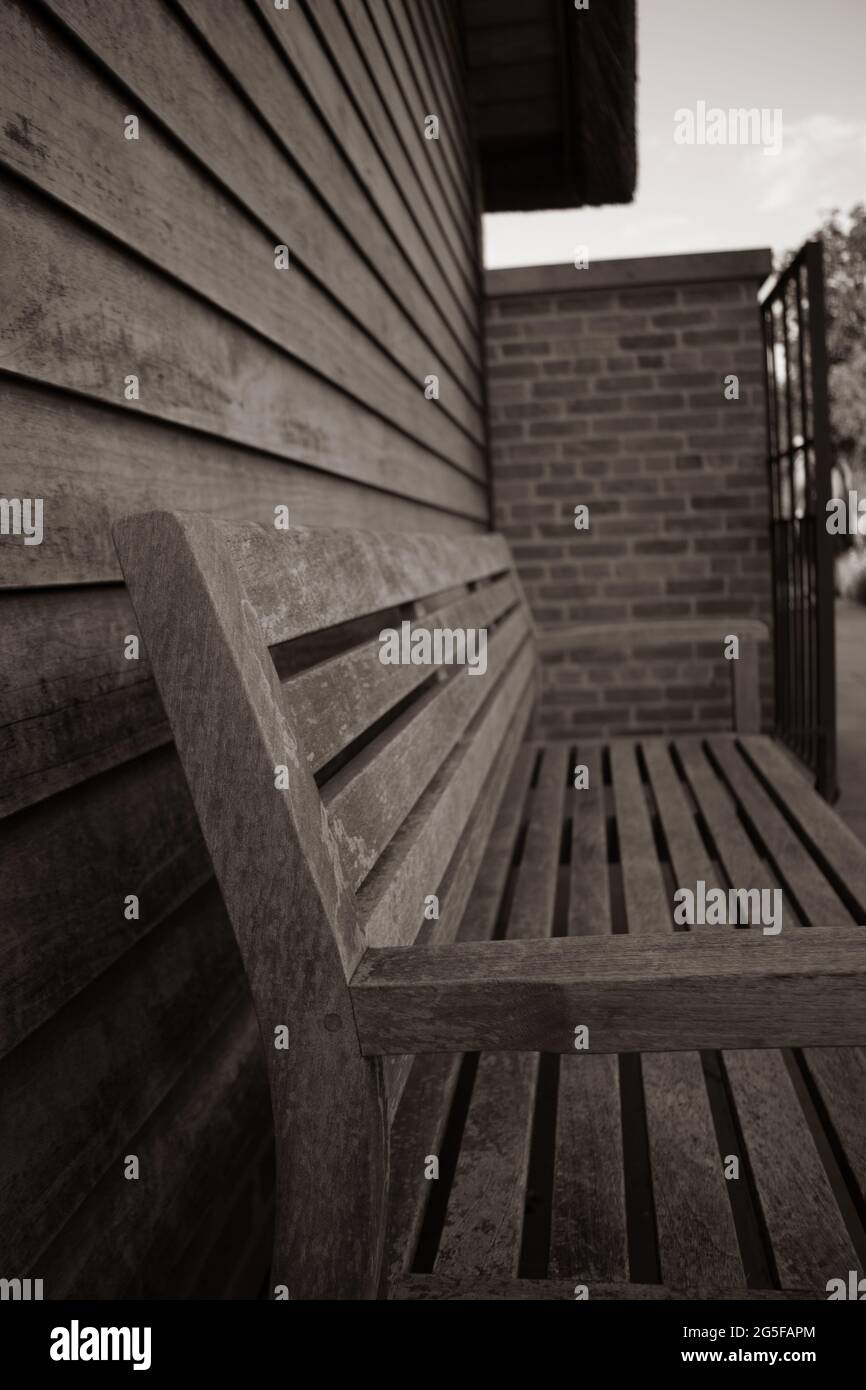 Old bench near of brick wall Stock Photo - Alamy