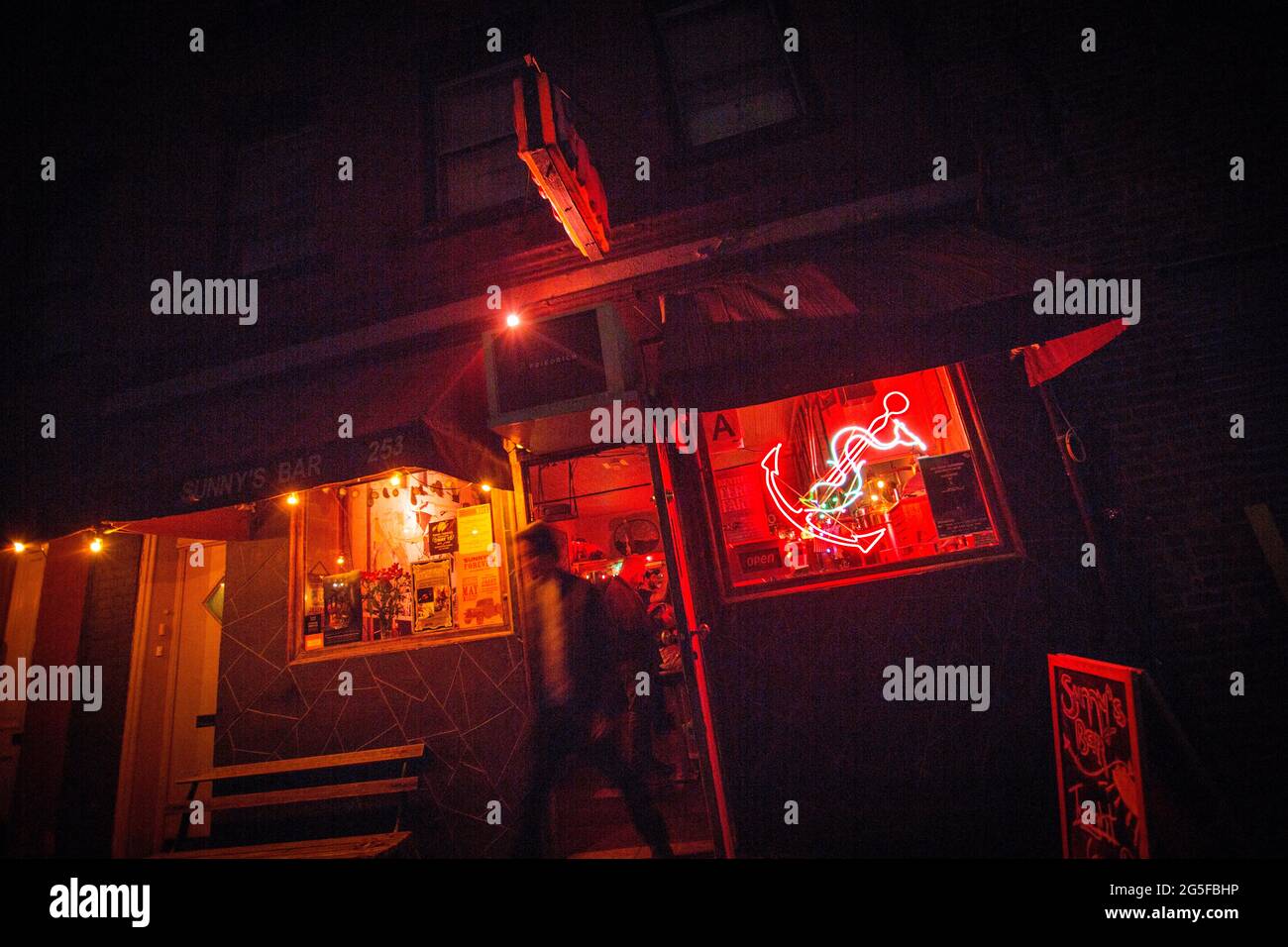 Sunny's Bar in Red Hook, Brooklyn. The old school, working class bar has kept its charm throughout the years Antonio "Sunny" Balzano and his wife Tone Johansen have been running it. The bar and its owners have weathered storms and economic downturns in the once remote neighborhood of Brooklyn. Sunny passed away in 2016, but Tone keeps the doors open, with concerts and live events for the patrons of the bar. Stock Photo