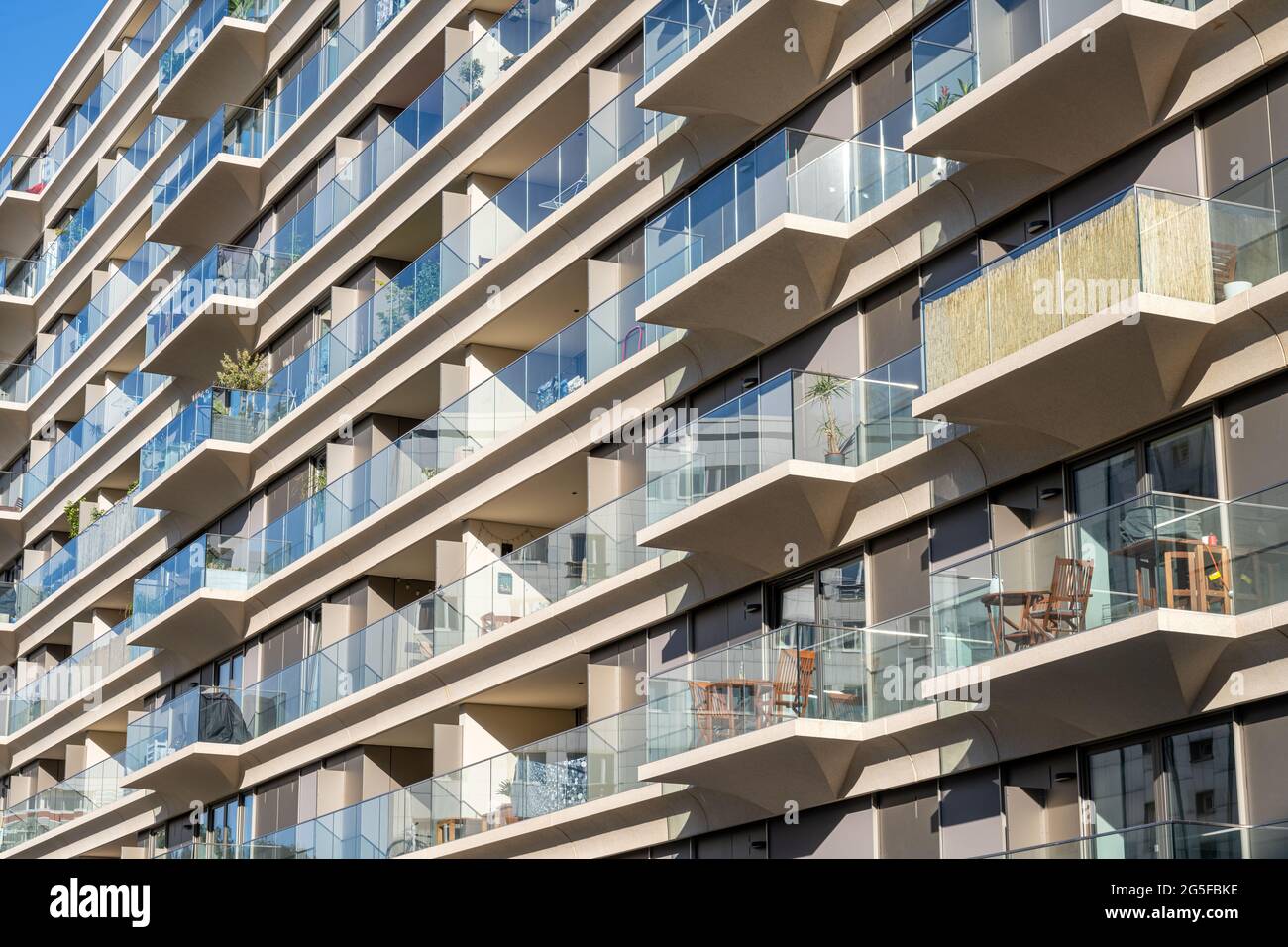 Facade of a modern apartment building with a lot of glass seen in Berlin, Germany Stock Photo