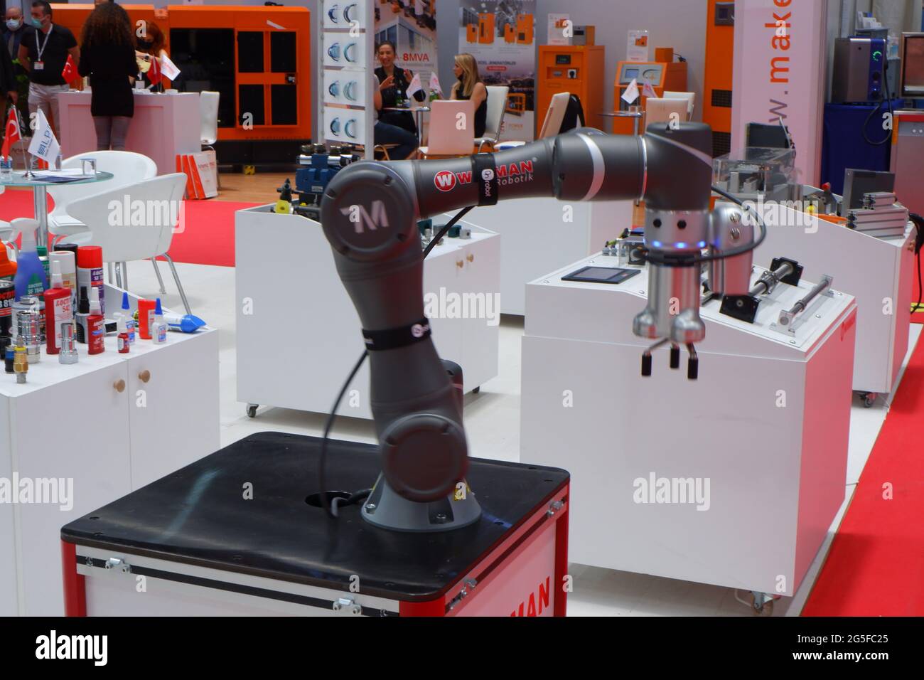 Industrial Robotic Hand at Industry Fair Indoor Stock Photo