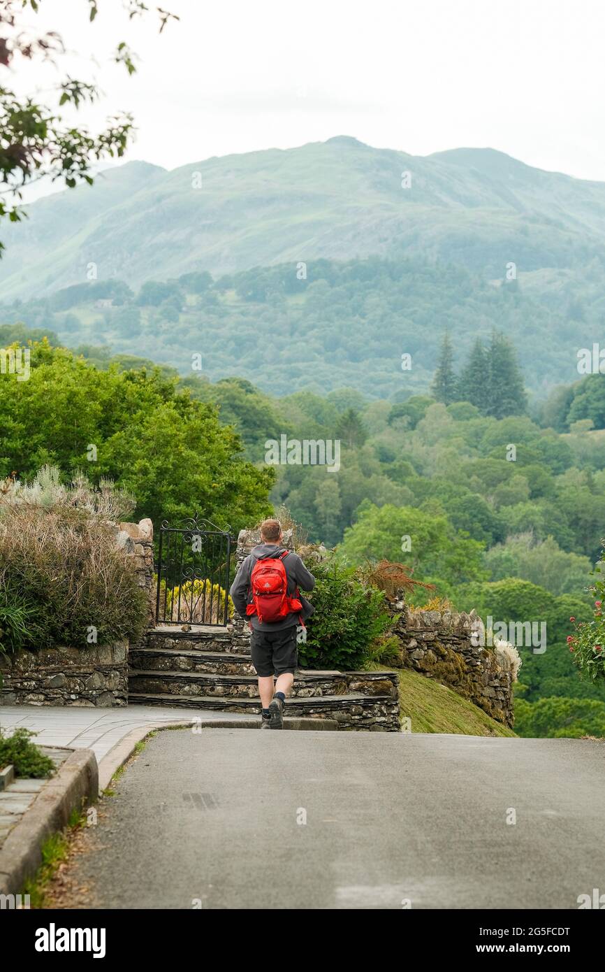 Walking in the Lake District through villages and fells. Stock Photo
