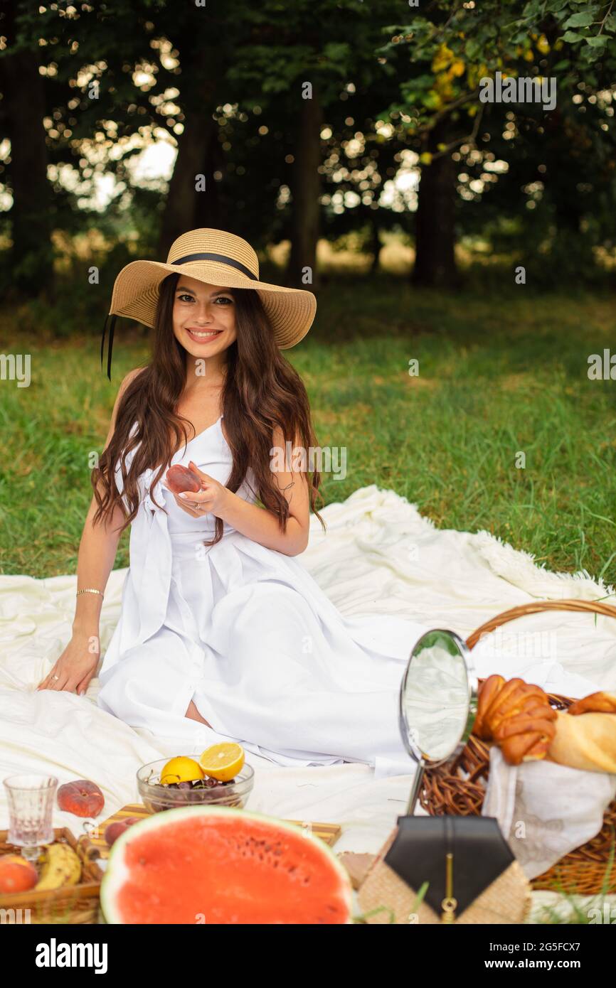 Attractive young lady posing near tree in the park Stock Photo - Alamy