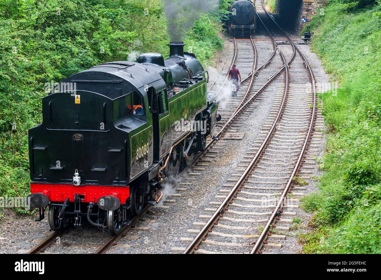 Duffield, Derbyshire, UK, June 22, 2021:Ecclesbourne Valley Railway with Preserved Steam Locomotive 80080 at Duffield Station Shunting in between Rail Stock Photo