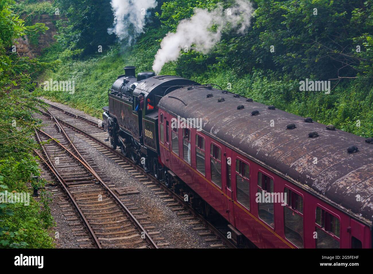 Duffield, Derbyshire, UK, June 22, 2021:Ecclesbourne Railway Steam Railway with Locomotive 80080 departing from Duffield Station on a train service to Stock Photo