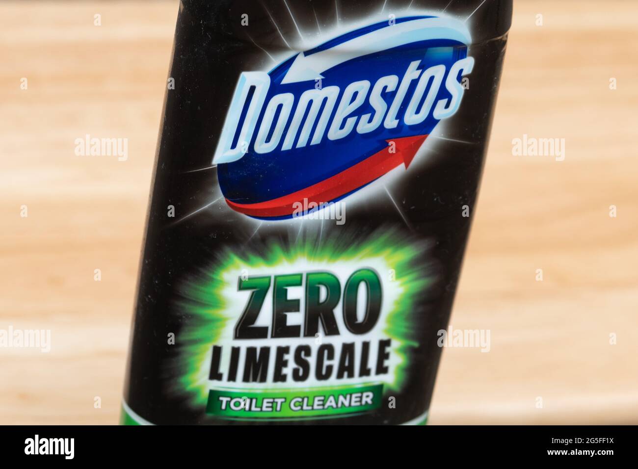 Bottle of Domestos zero limescale bleach, cleaning product in black bottle Stock Photo