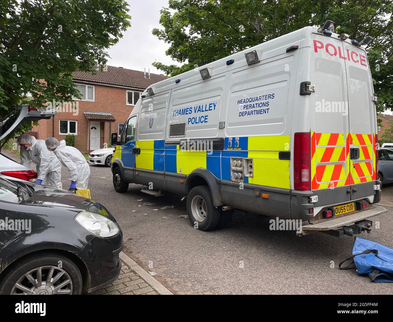 Police at the scene in Denmead, Two Mile Ash, in Milton Keynes, where a man has died after police fired gun shots at a property and where a second man was found dead and a young child seriously injured. Thames Valley Police (TVP) said in a statement officers were called to an address in Denmead, Two Mile Ash, at about 9.40am on Saturday and made a forced entry after acting on information from a witness. Picture date: Sunday June 27, 2021. Stock Photo