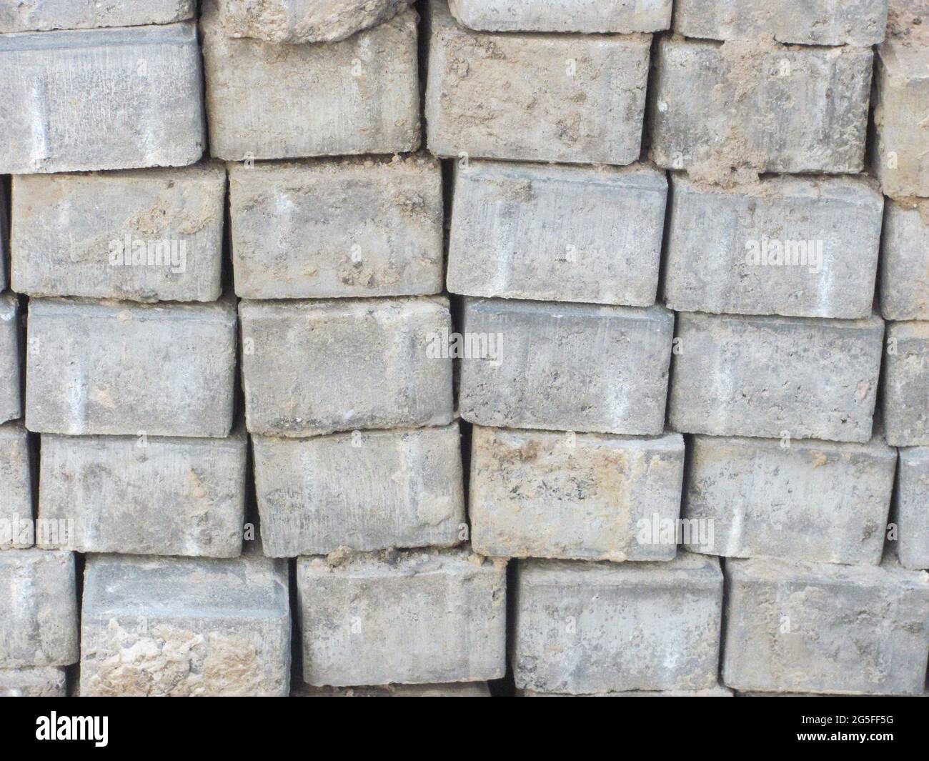 A stack of dirty gray bricks Stock Photo