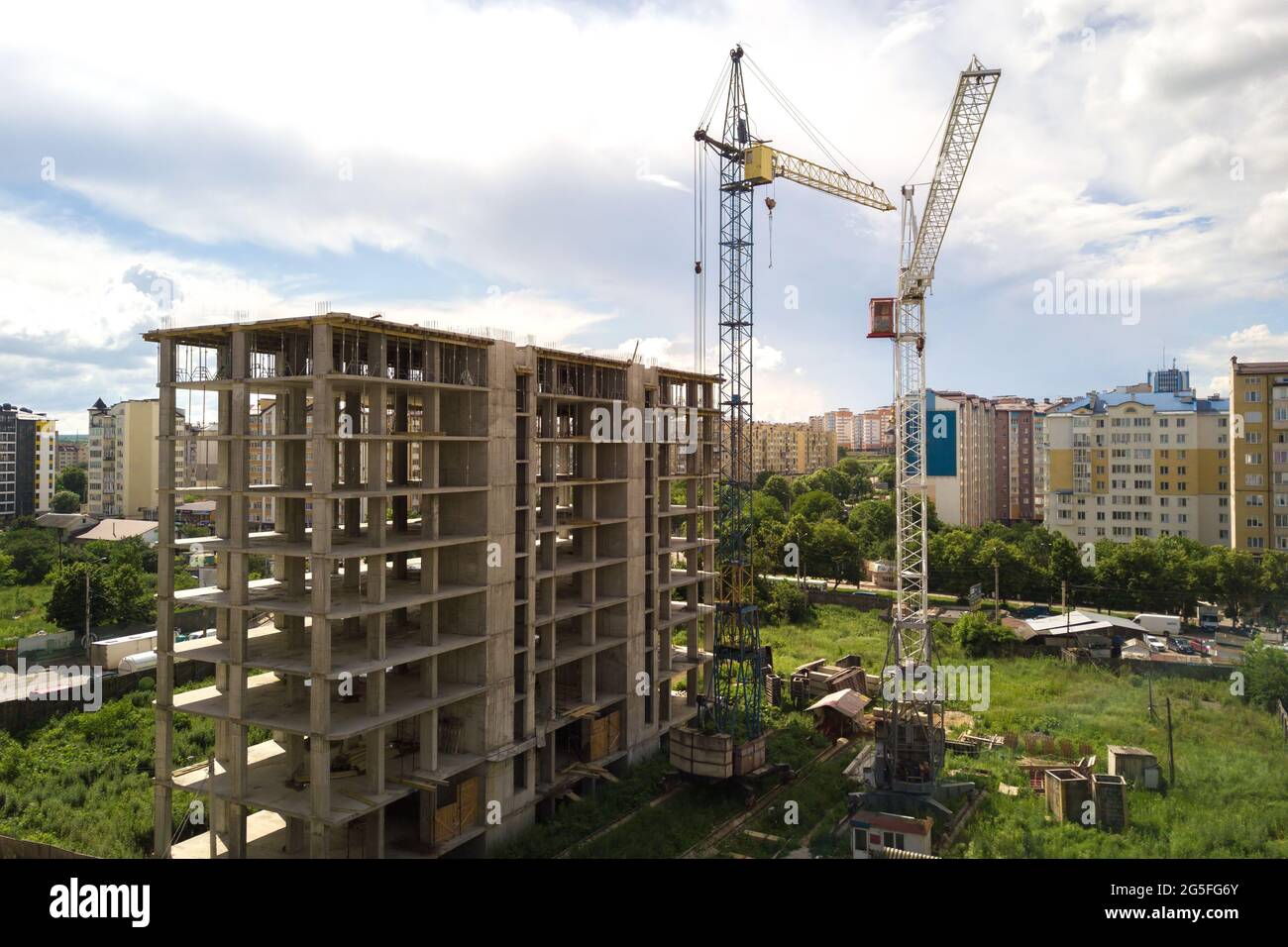Aerial view of high tower crane and residential apartment buildings ...