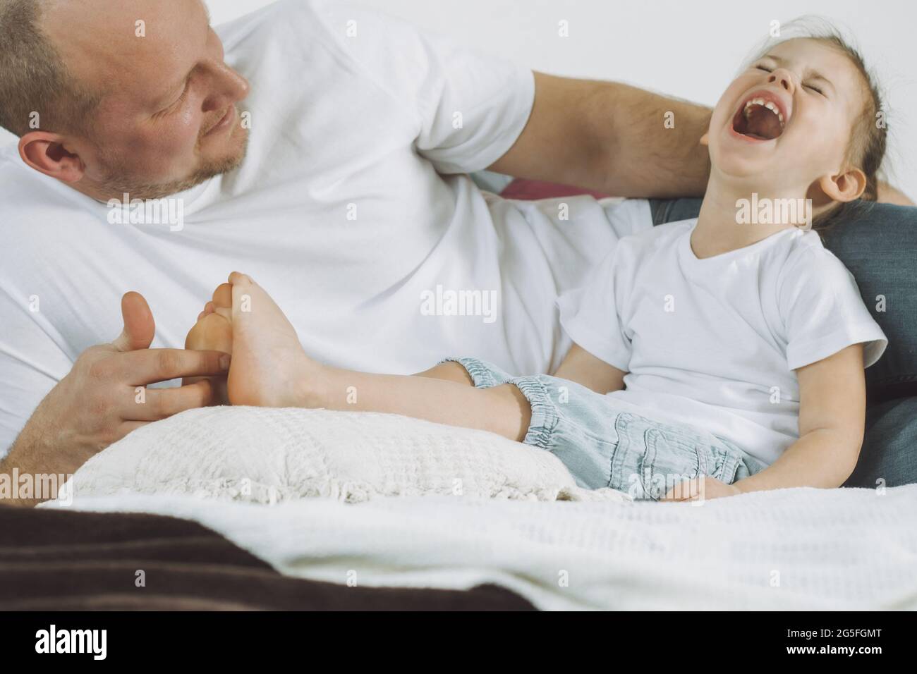 Tickling foot father hires stock photography and images Alamy