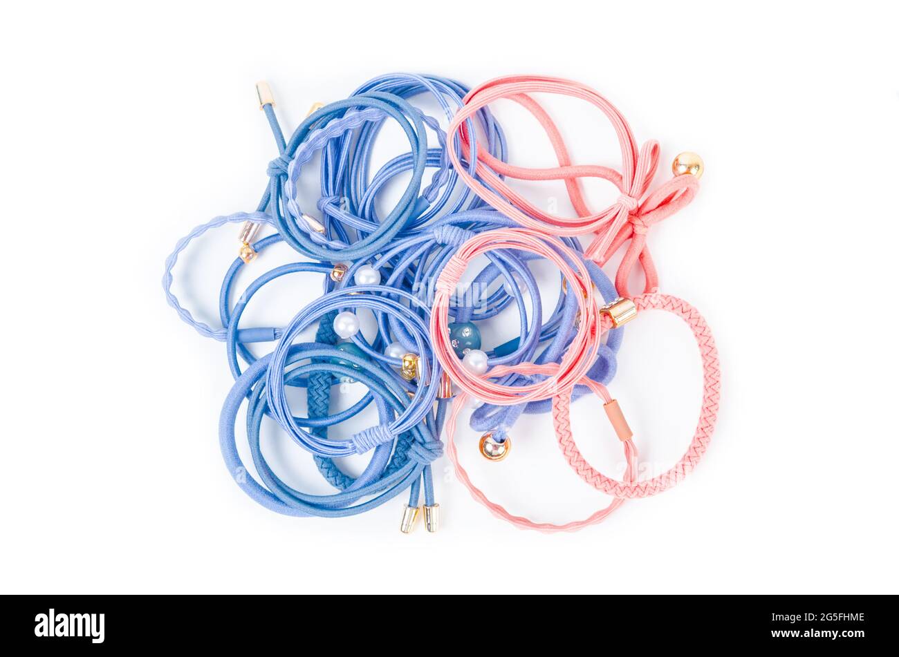 Heap of colorful fabric rubber bands. Elastic hair ties in vibrant colors on white background. Stock Photo