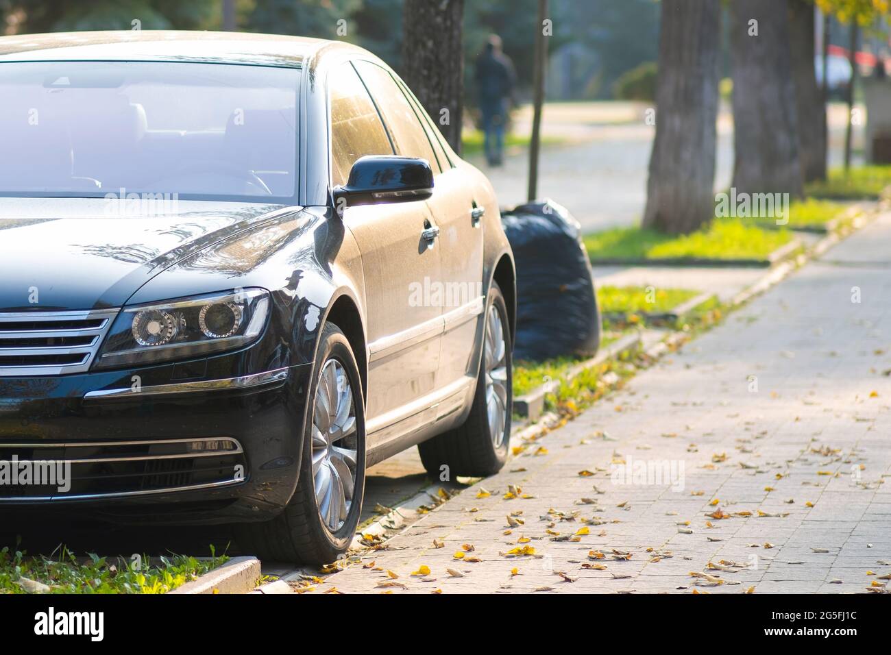 Cars parked on a city street side on pedestrian zone Stock Photo - Alamy