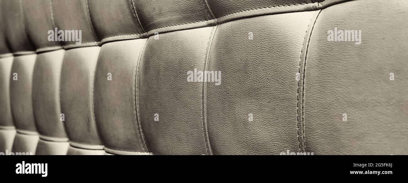 Tufted grey leather headboard texture, used for background Stock Photo