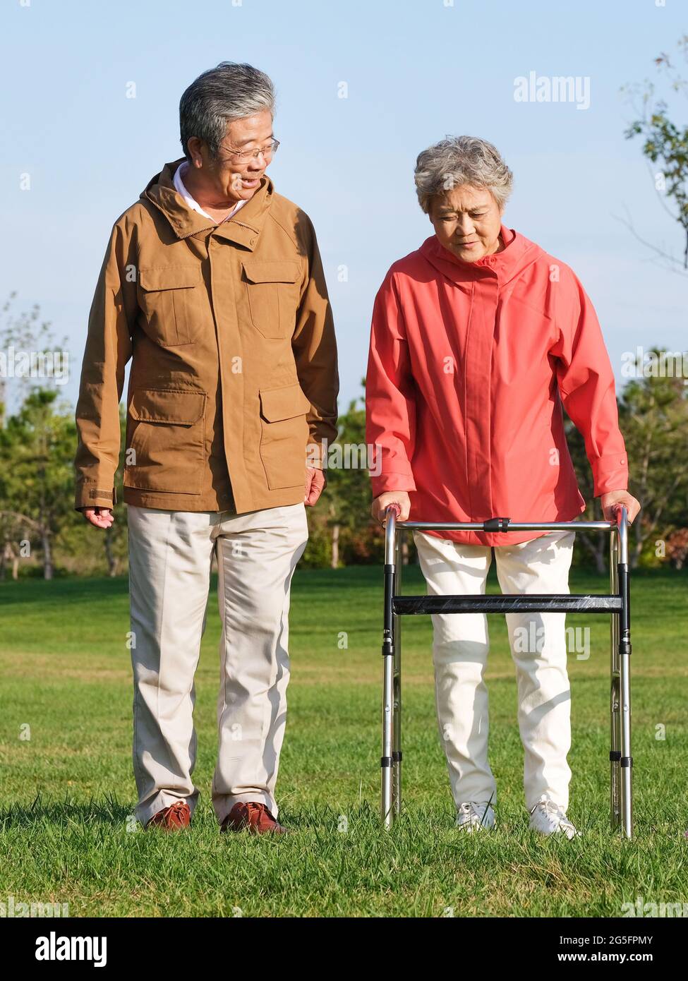 Happy old couple walking in the park high quality photo Stock Photo